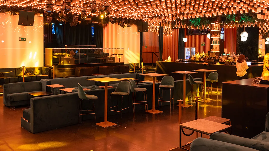 Main room with tables and VIP seating at Oh My Club Madrid