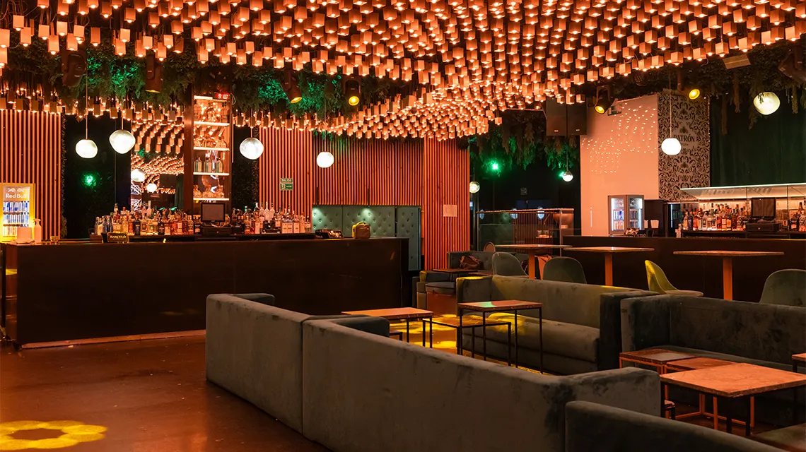 Main room with bar and lounge area at Oh My Club Madrid