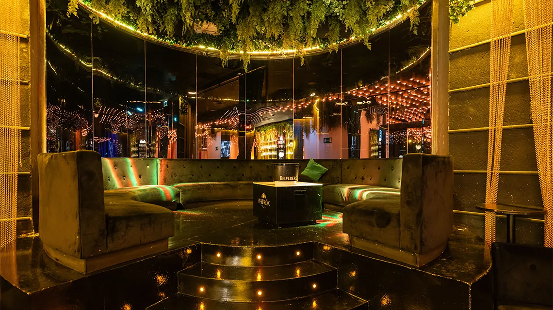Onix room with circular lounge area at Oh My Club Madrid